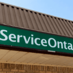 image of a green service Ontario sign above an office