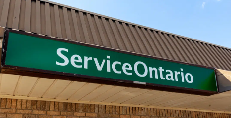 image of a green service Ontario sign above an office